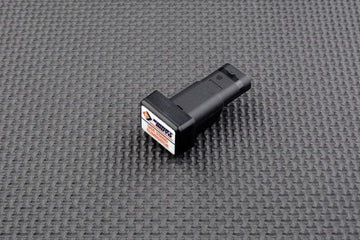 BMW R nineT 2013 - 2024 Side Stand Switch Eliminator performance mod with plug-and-play connector on textured black background.